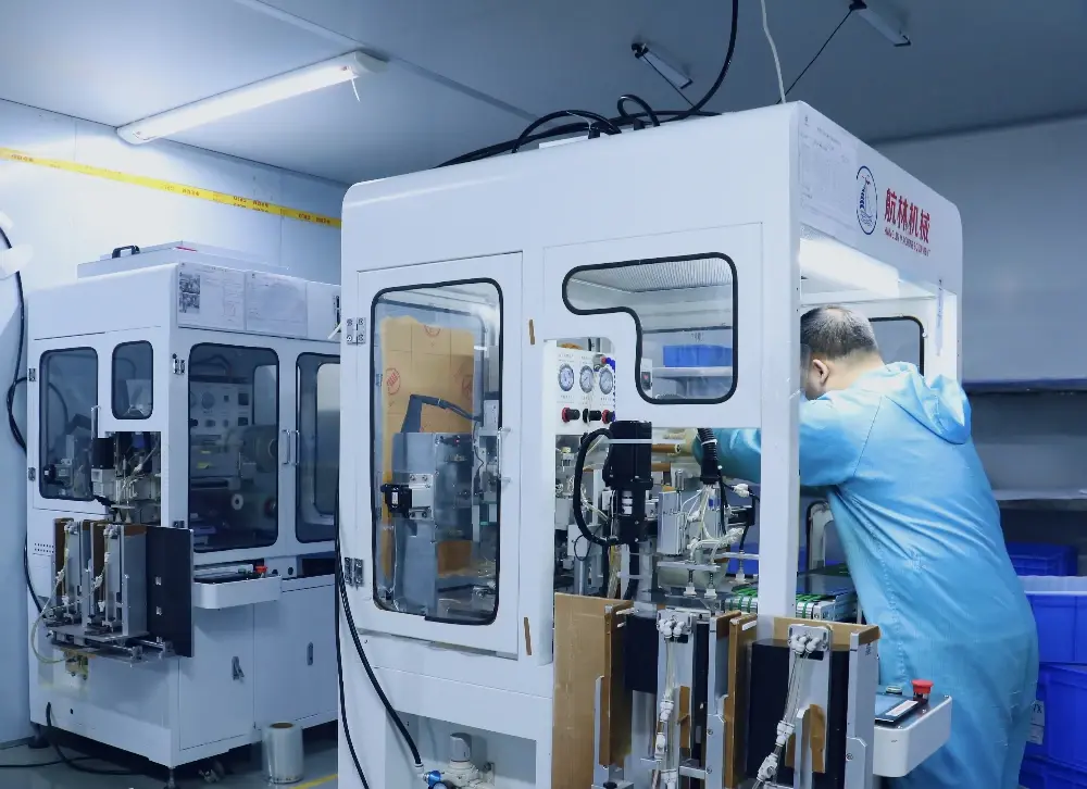 Automated screen protector manufacturing machine operated in cleanroom at Dongguan Aifeng factory